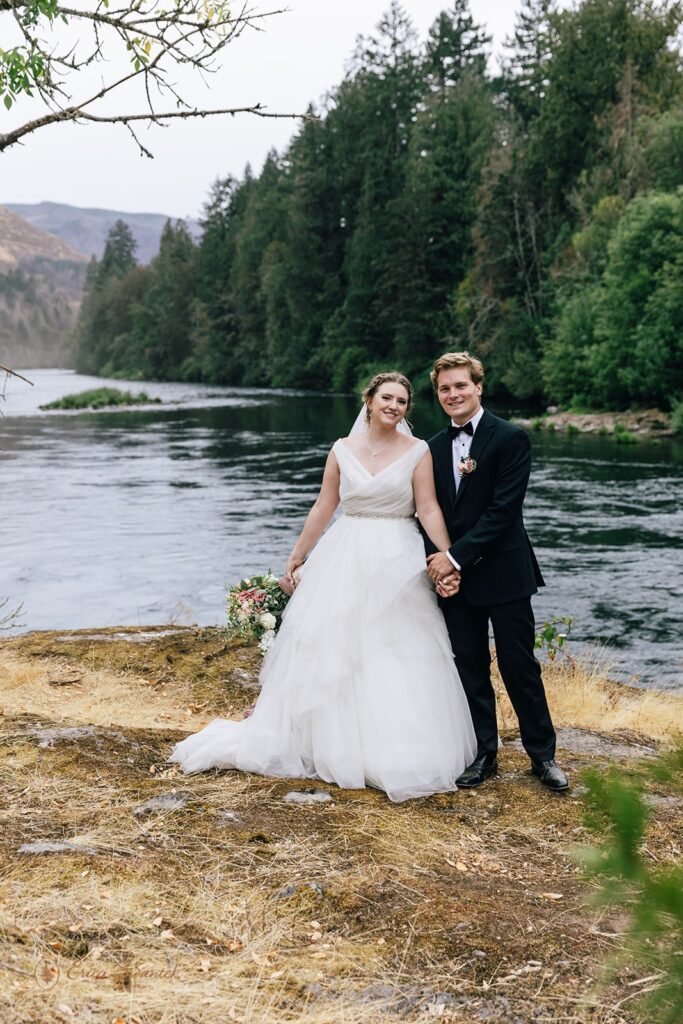 romantic bride and groom at the McKenzie River shore for their Oregon Elopement 
