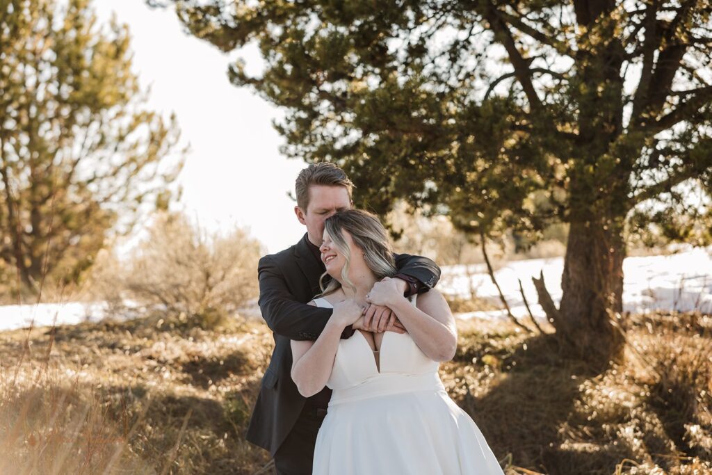 romantic bride and groom moments during golden hour for their sunriver, OR, winter elopement 