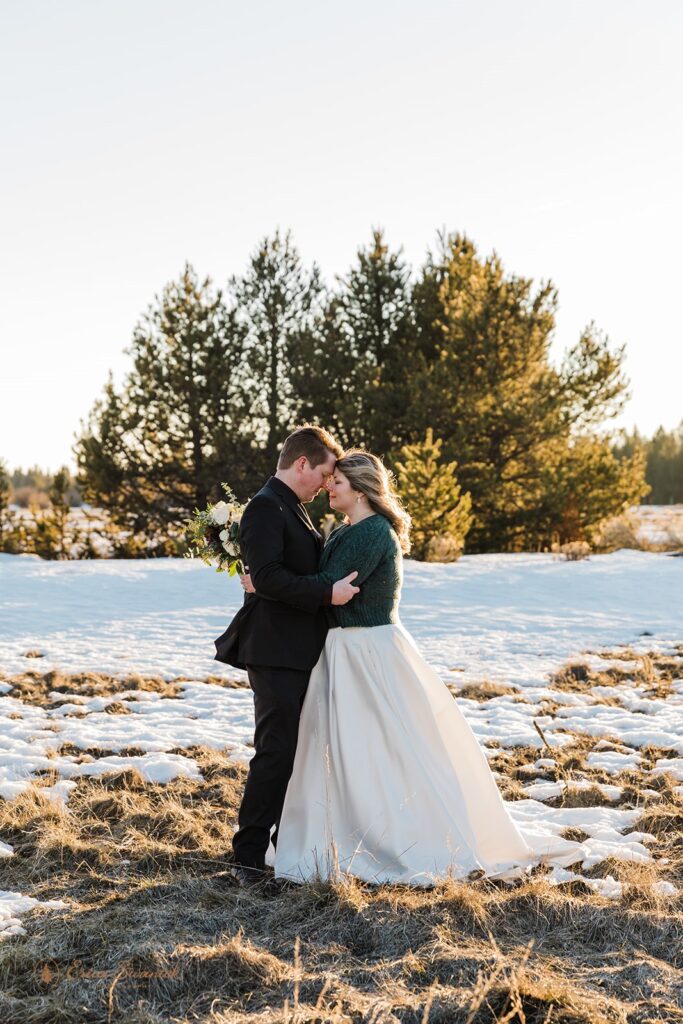 romantic bride and groom moments during golden hour for their sunriver, OR, winter elopement 