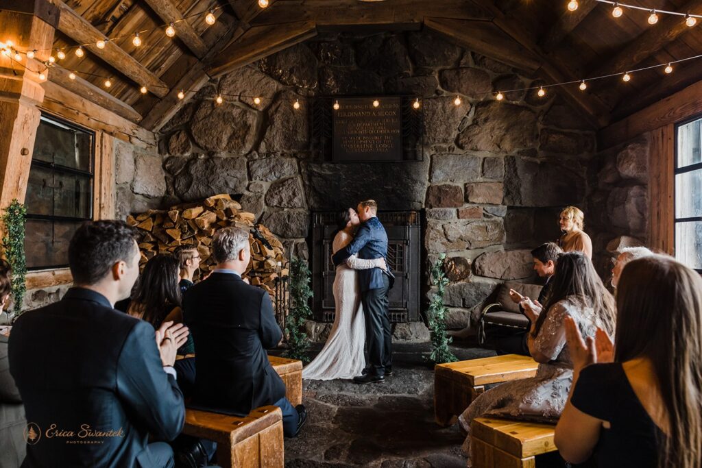 cozy elopement ceremony in silcox hut during a winter day