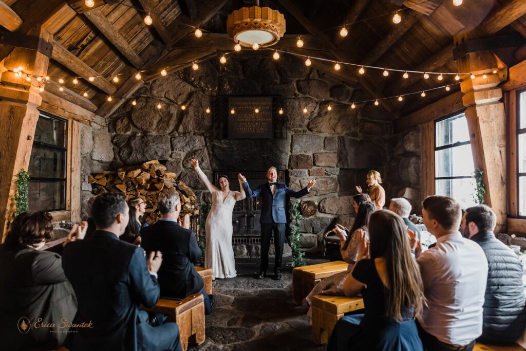 cozy elopement ceremony in silcox hut during a winter day