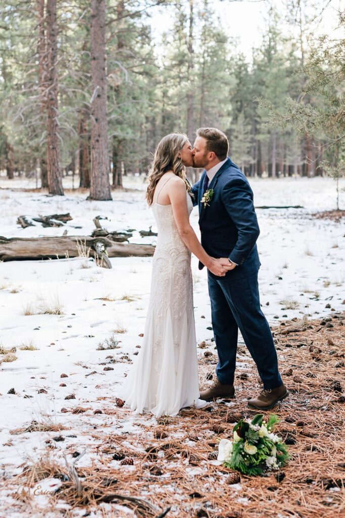 bride and groom roaming the forest together during their fivepine lodge elopement