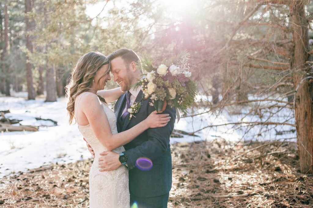 sweet moment between bride and groom during golden hour