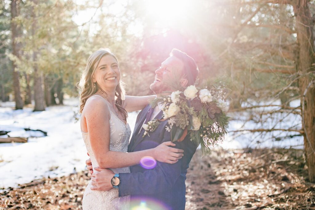 sweet moment between bride and groom during golden hour