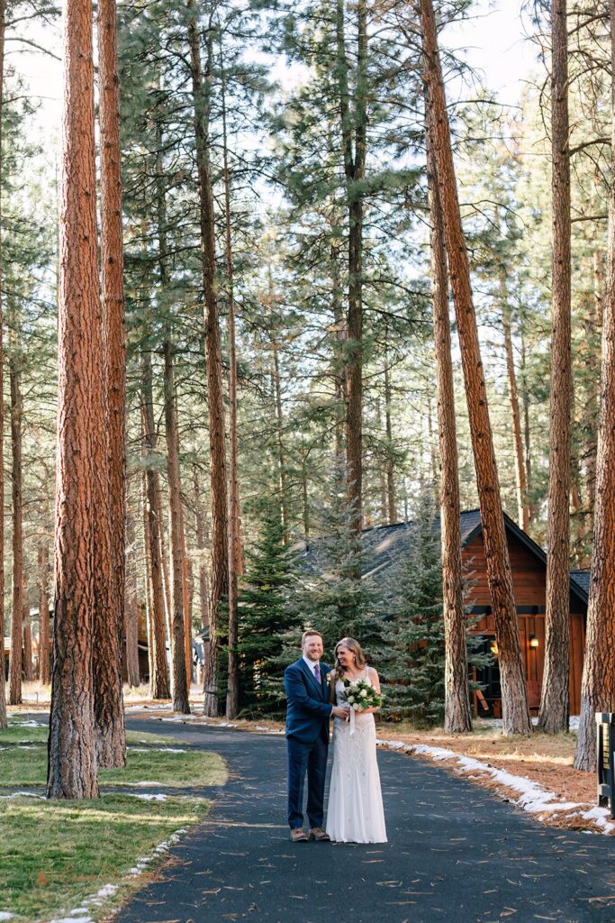 bride and groom roaming the forest together during their fivepine lodge elopement