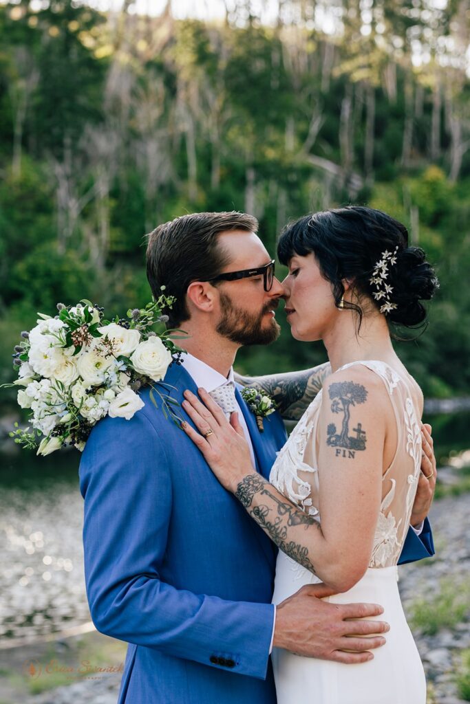 romantic bride and groom sharing intimate moments during their chetco river inn elopement