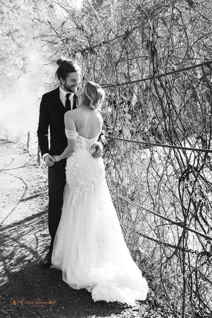romantic bride and groom surrounded by lush forests during their Belknap Hot Springs elopement