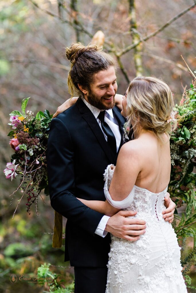 romantic bride and groom surrounded by lush forests during their Belknap Hot Springs elopement