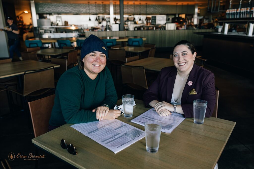 lgbtq couple enjoying beers at pelican brewing oregon