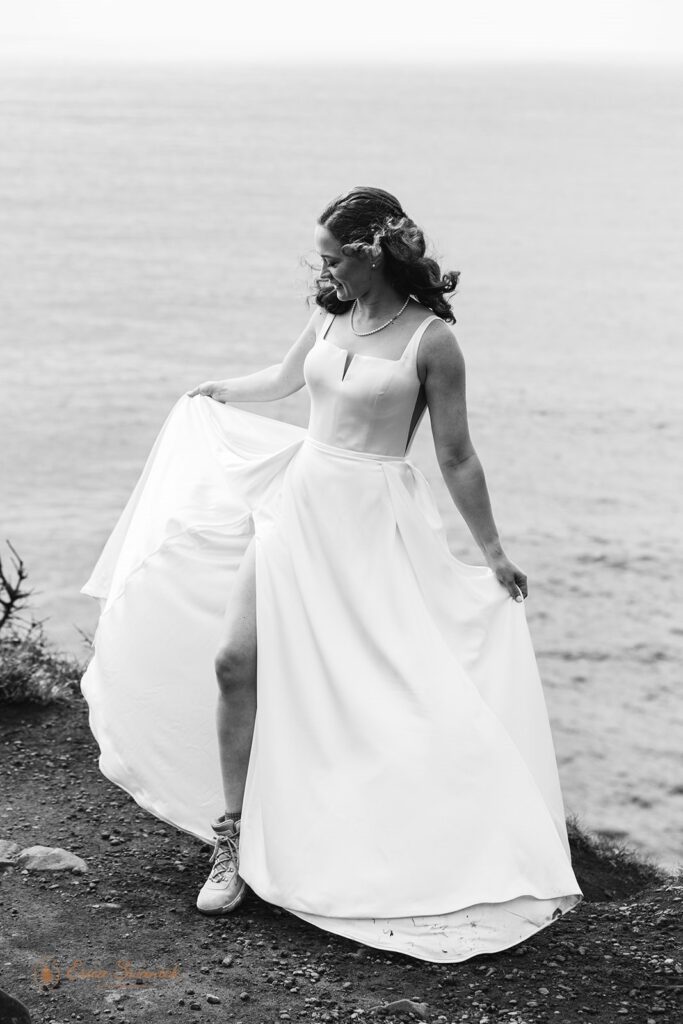 bridal portraits on the cliff with ocean views during their oregon coast micro wedding