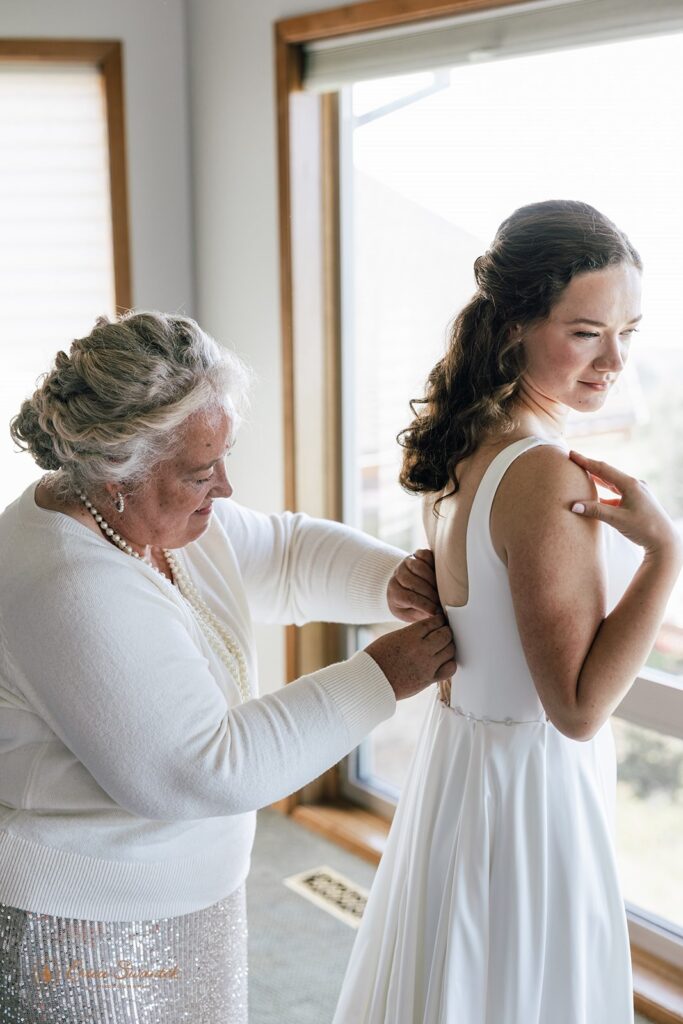 bride getting ready with her mom