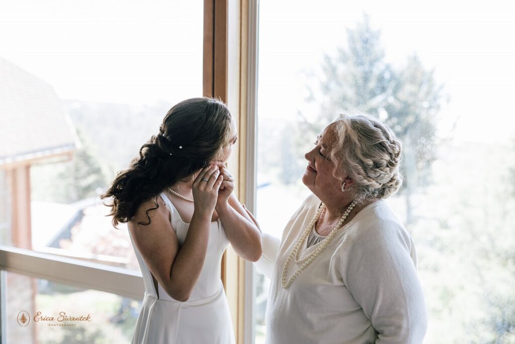 bride getting ready with her mom