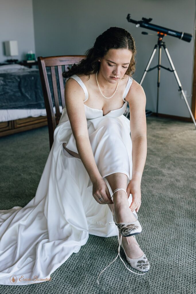 bride putting on her shoes