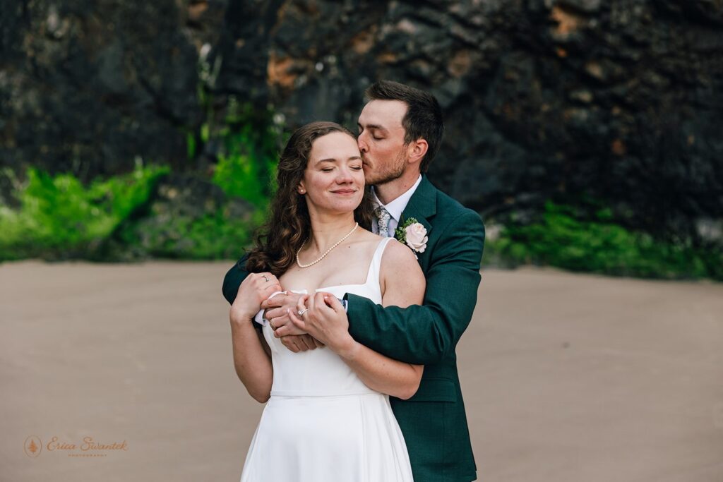 bride and groom hugging during their dreamy oregon coast micro wedding
