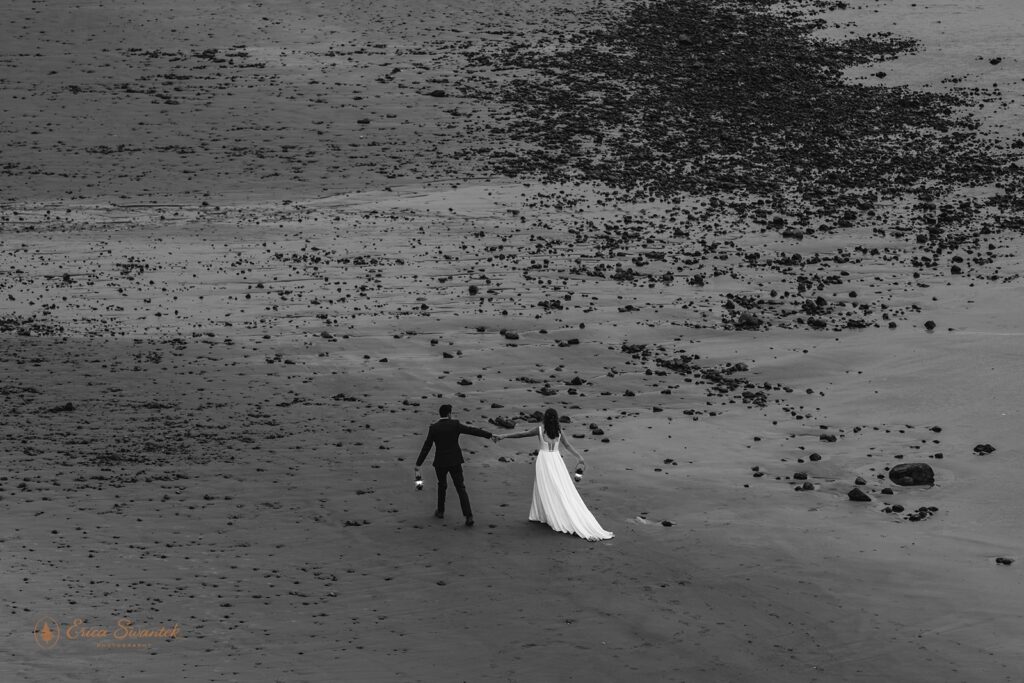 bride and groom having fun along the oregon coast