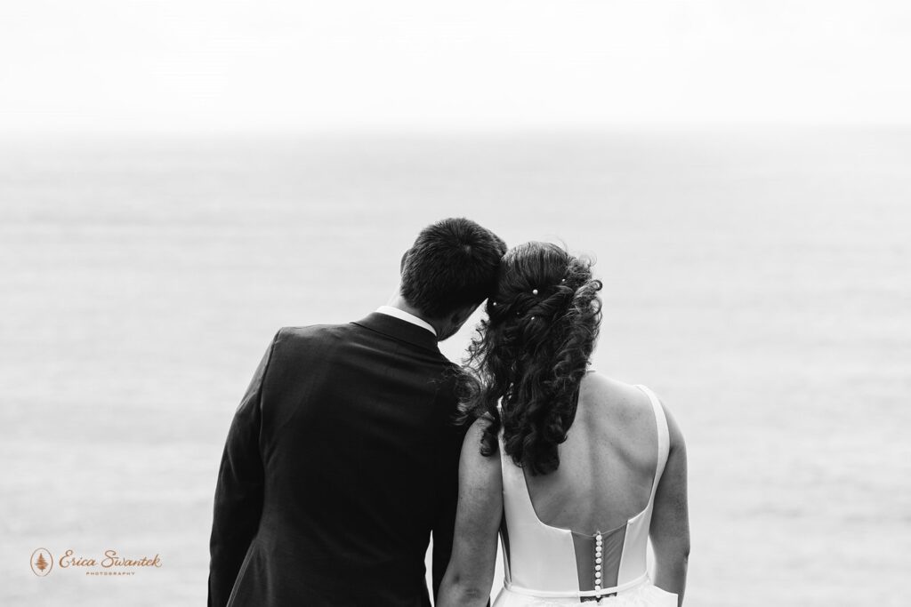 bride and groom gazing at the ocean during their oregon coast micro wedding