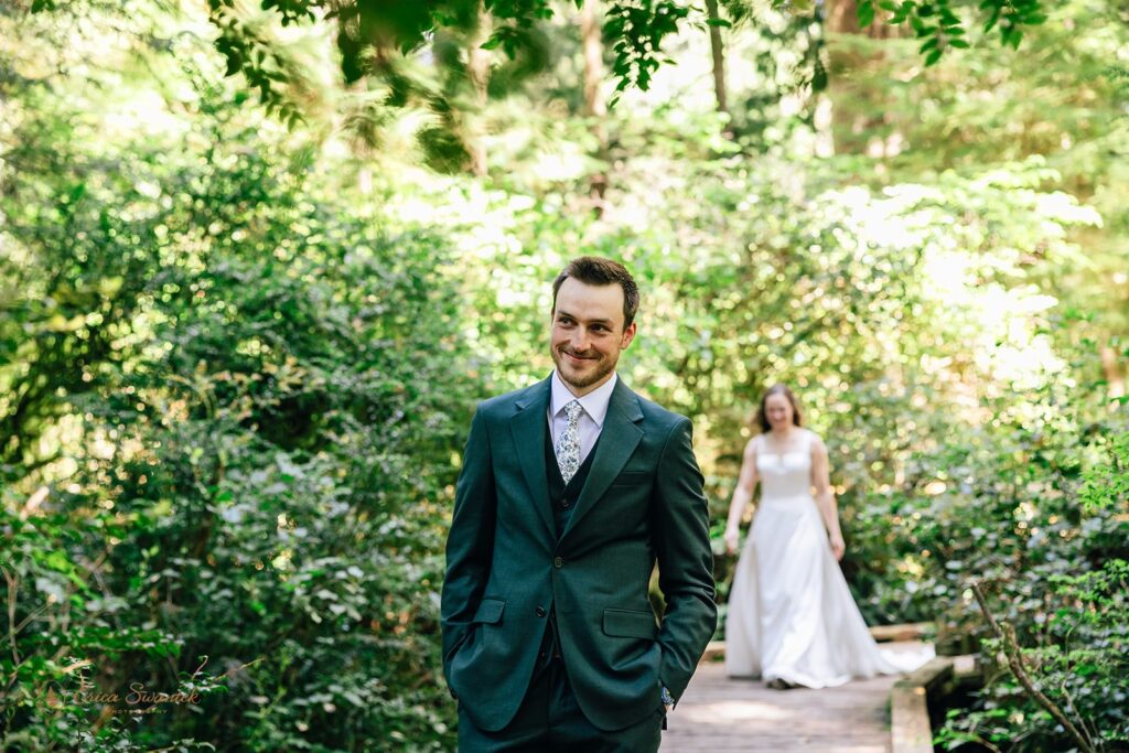 bride and groom first look in the forest during their oregon coast micro wedding day
