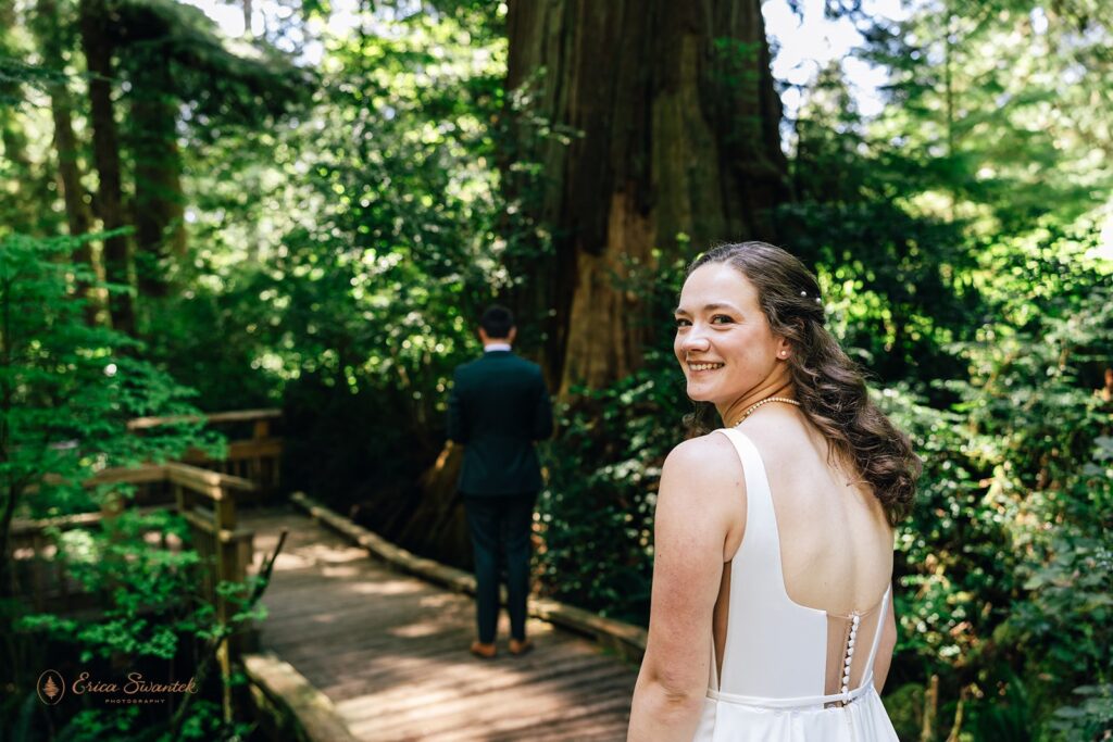 bride and groom first look in the forest during their oregon coast micro wedding day