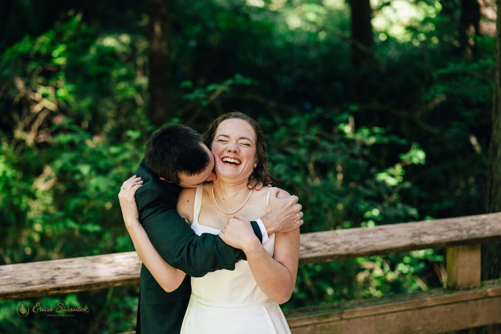 bride and groom walking a forest trail during their oregon coast micro wedding day