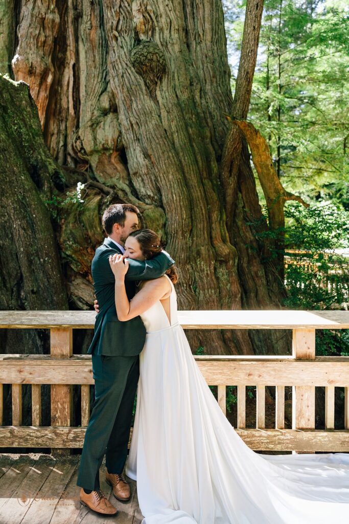 bride and groom hugging in the forest during their oregon coast micro wedding day