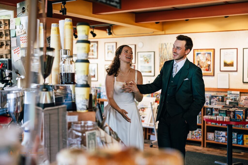 bride and groom in a coffee shop during their elopement day