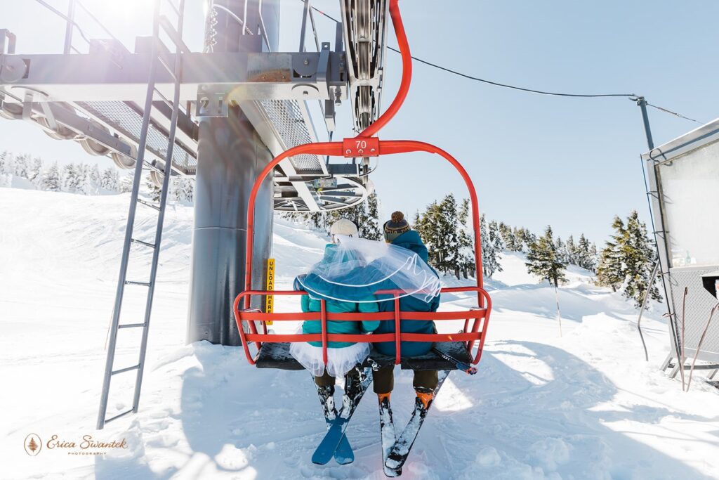 elopement couple on the ski lift during their winter skiing elopement at mt bachelor