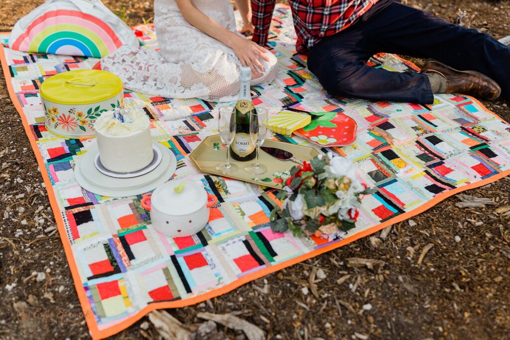 newlyweds enjoying an elopement picnic during their crater lake elopement day