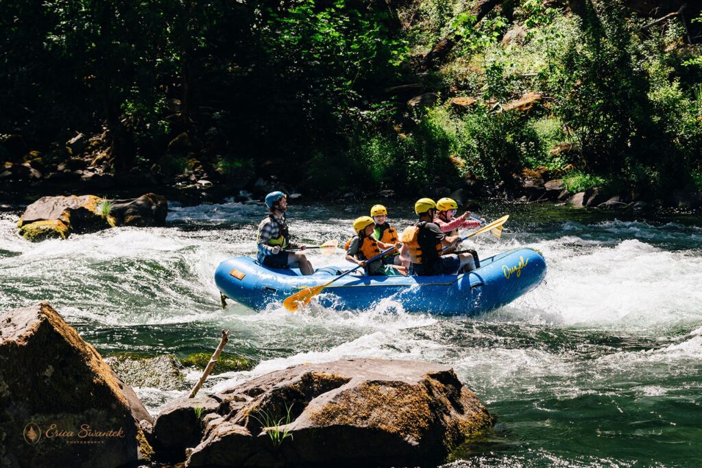 people enjoying rafting together