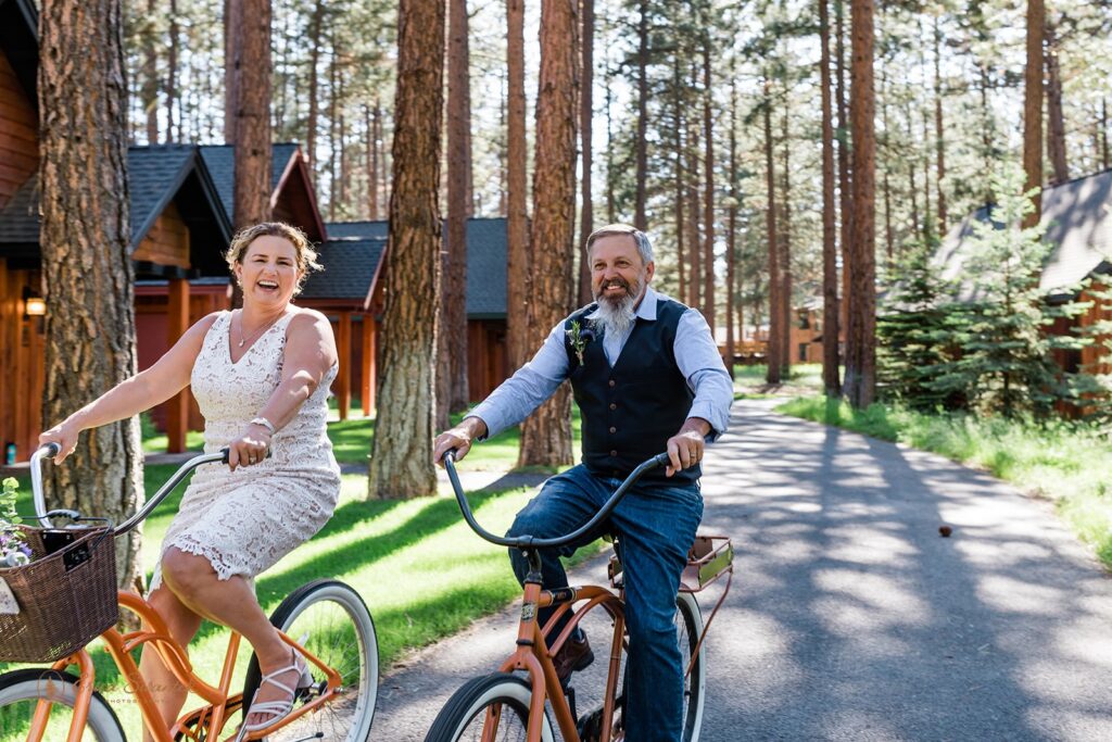 fun elopement couple riding bikes together during their adventurous oregon elopement