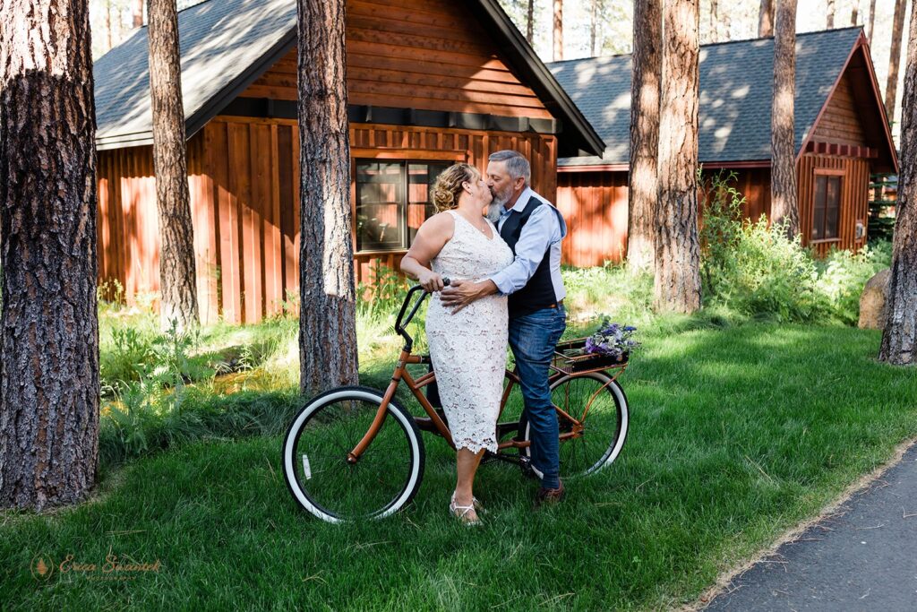 fun elopement couple riding bikes together during their adventurous oregon elopement