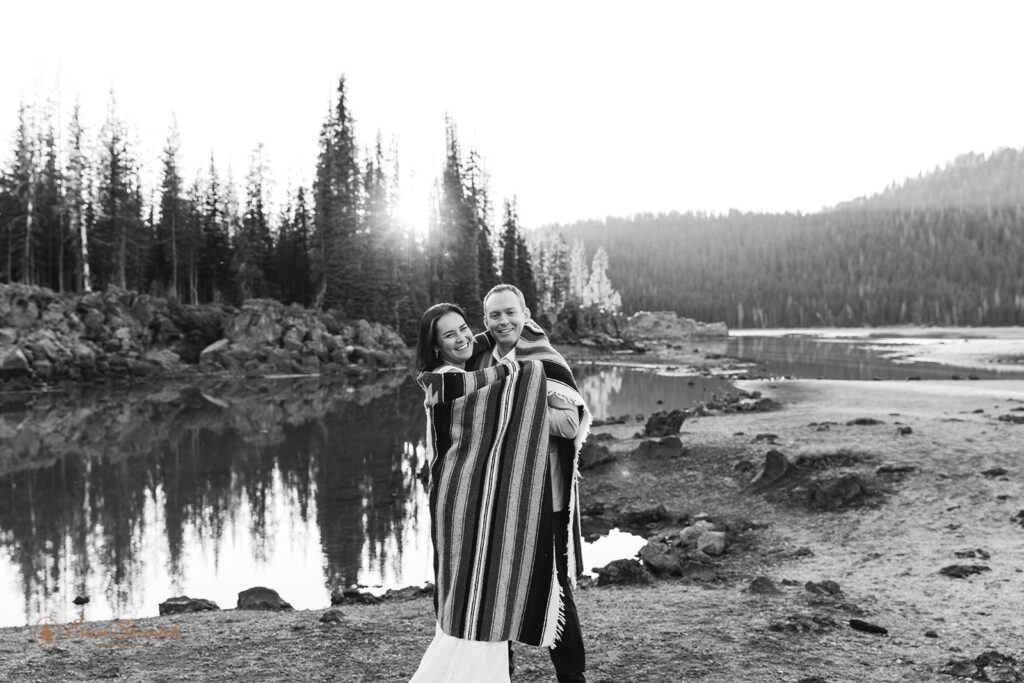 bride and groom wrapped in a blanket together during their bend, oregon elopement