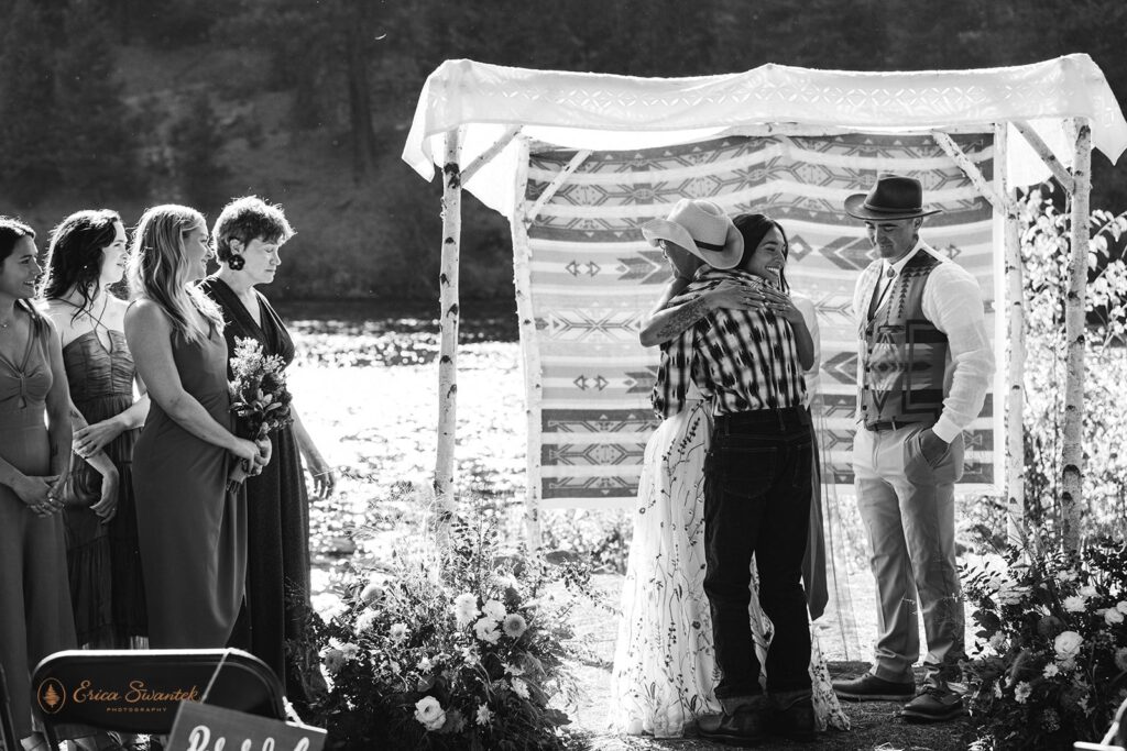 bride hugging dad ahead of the wedding ceremony