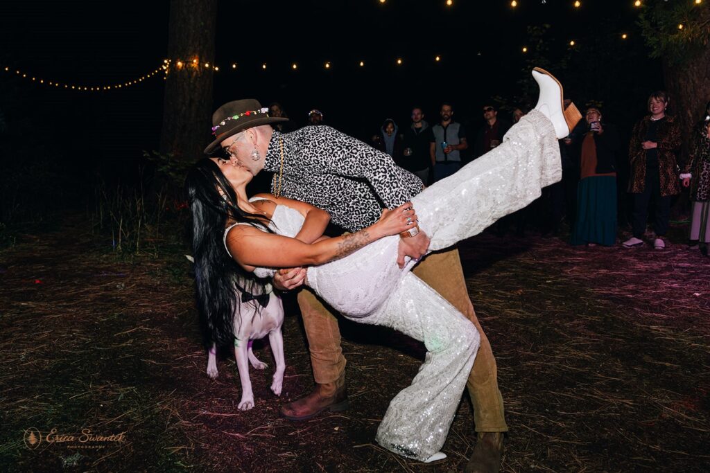 bride and groom dancing under disco lights during their festival inspired wedding reception
