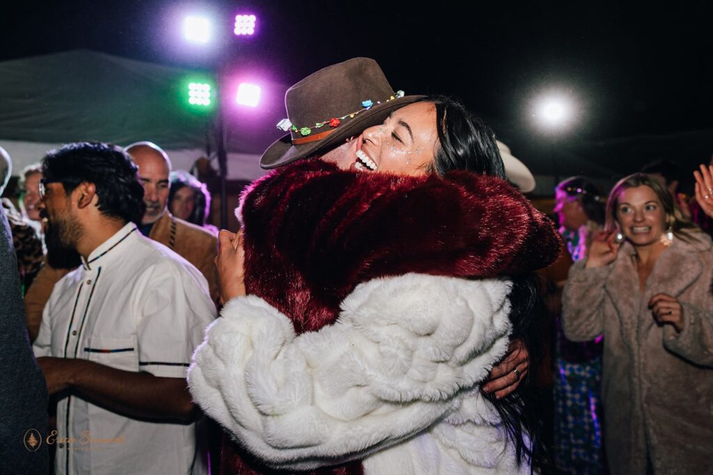 bride and groom hugging during wedding reception