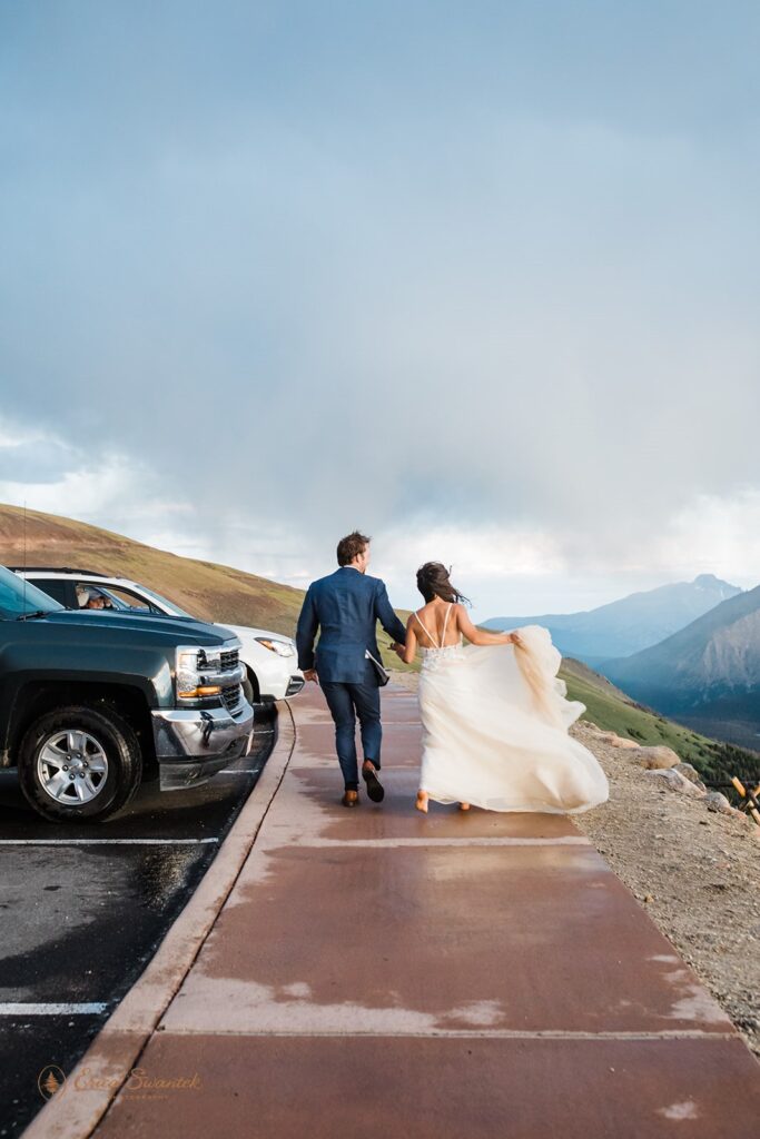 adventurous couple hiking duringg their rocky mountain national park elopement day in colorado
