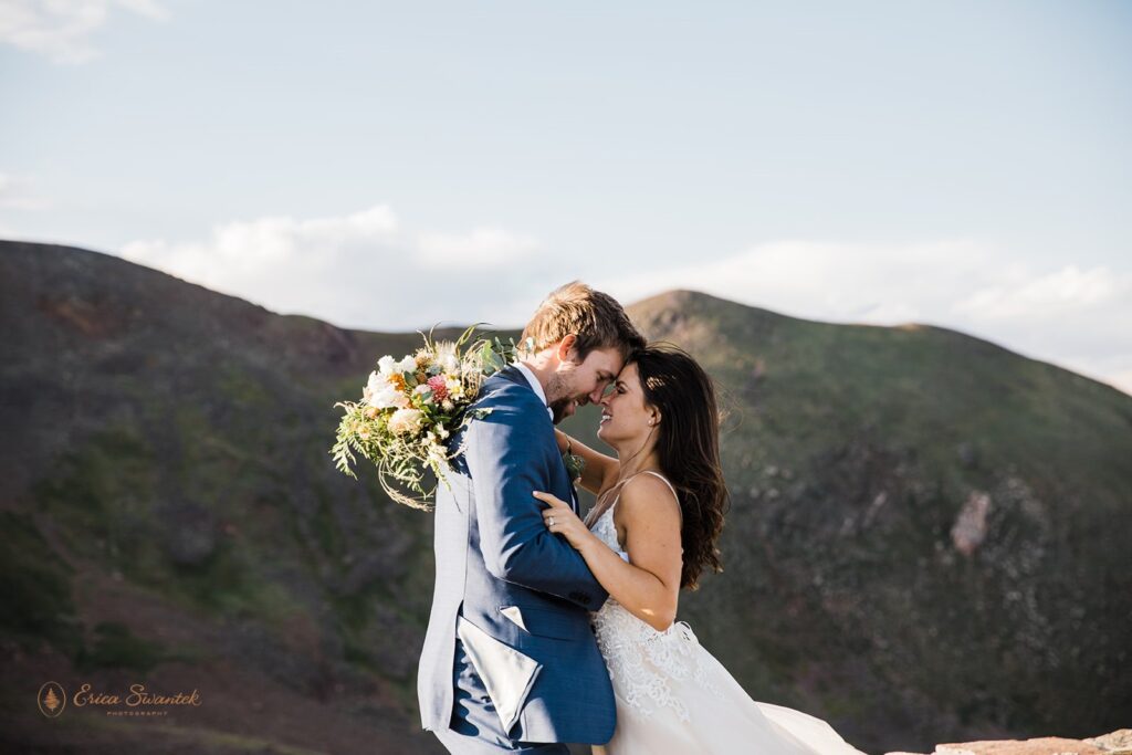 adventurous elopement couple hugging at the Lava Cliffs in RMNP