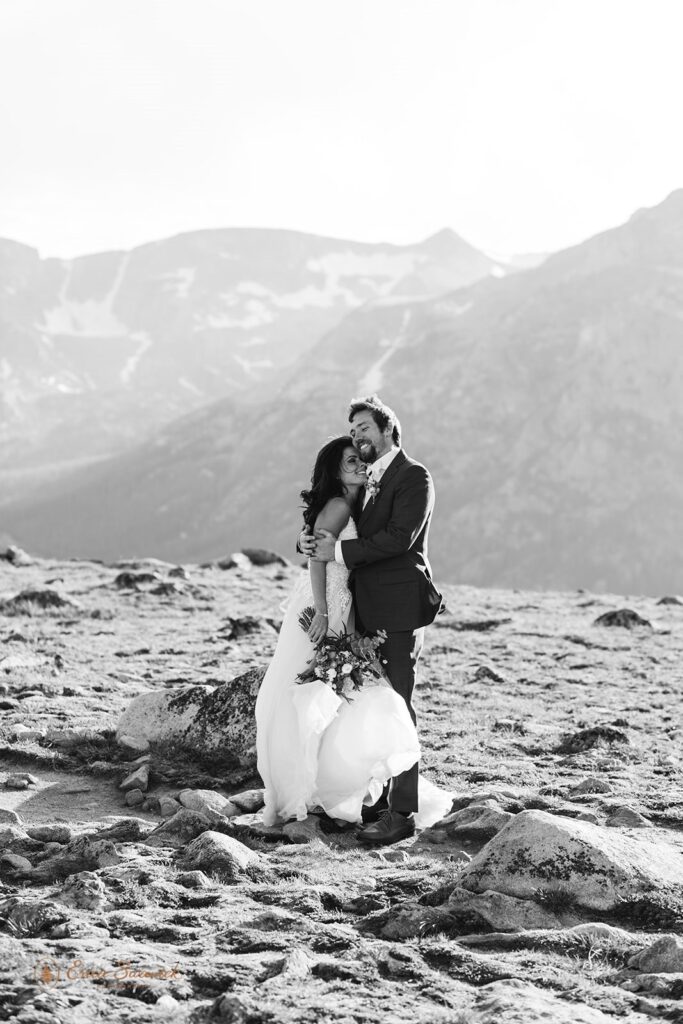 adventurous elopement couple hugging in UTE trail in RMNP