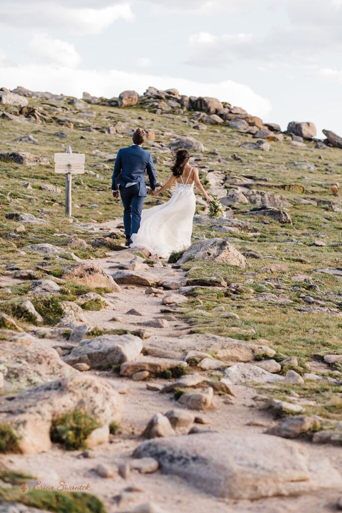 adventurous couple hiking duringg their rocky mountain national park elopement day in colorado