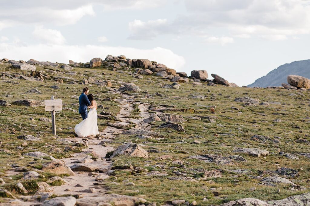 adventurous elopement couple hugging in UTE trail in RMNP