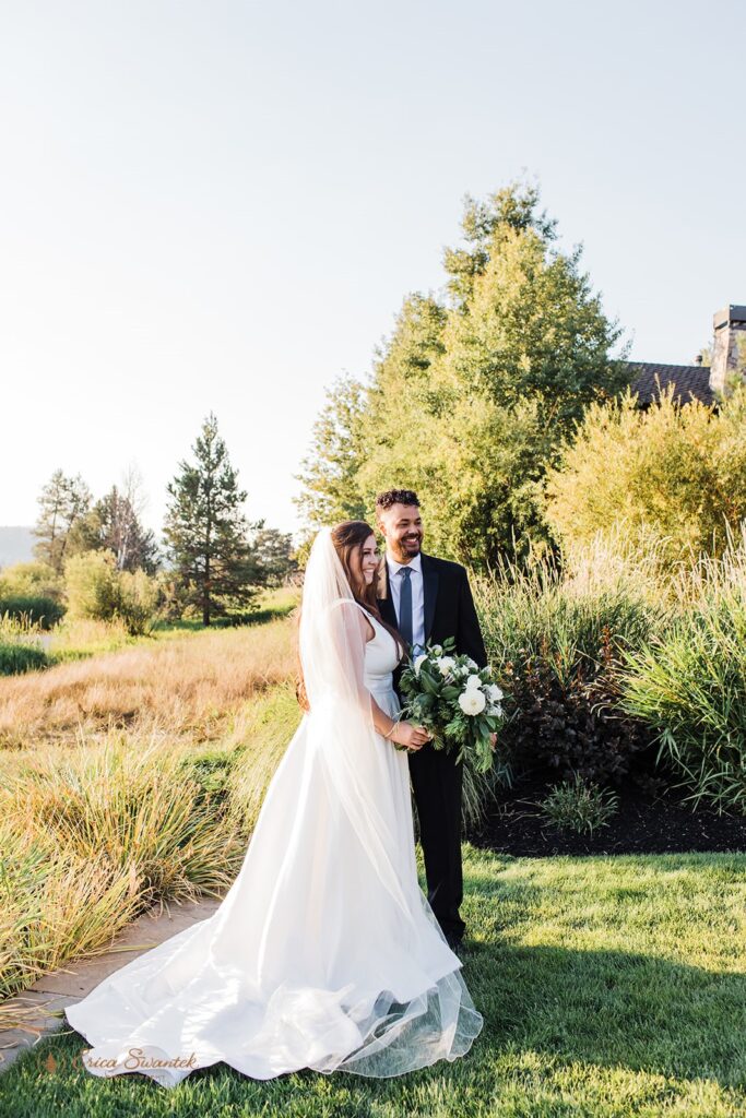 bride and groom posing outdoors