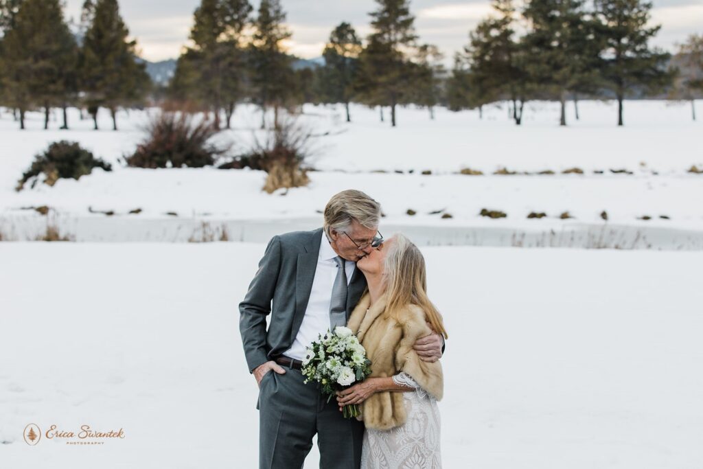 bride and groom surrounded by snowy winter landscapes in sunriver