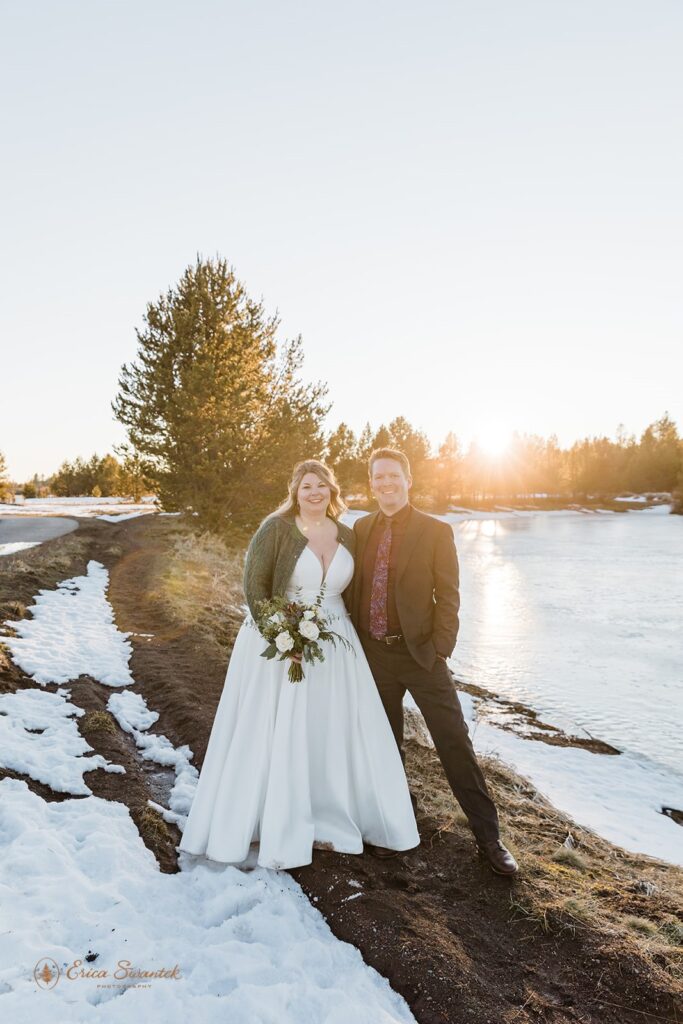 bride and groom surrounded by snowy winter landscapes in sunriver