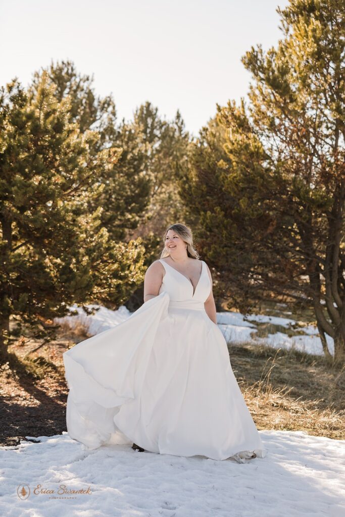 bridal portrait surrounded by snowy winter landscapes in sunriver