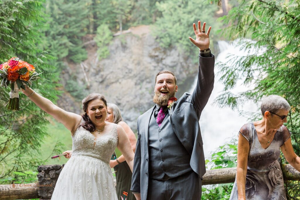 A couple gets married at Sahalie Falls on the McKenzie River in Oregon.