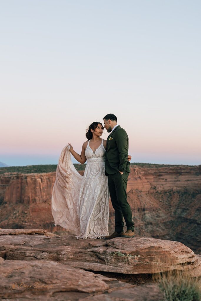 adventurous elopement couple at a desert viewpoint during their moab elopement