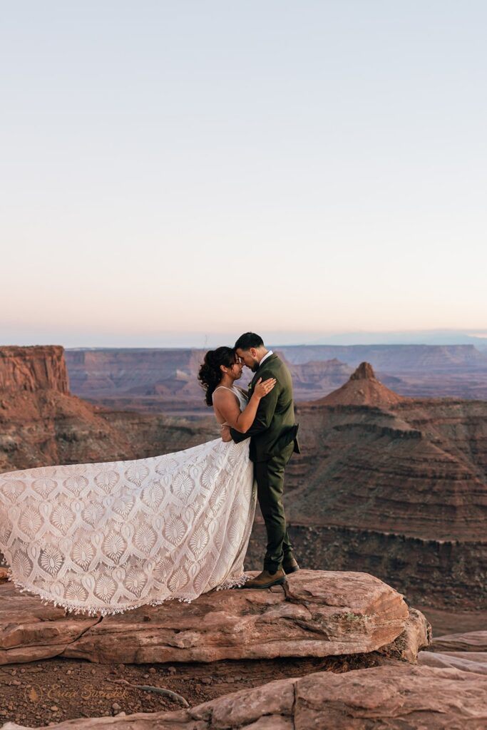 adventurous elopement couple at a desert viewpoint during their moab elopement