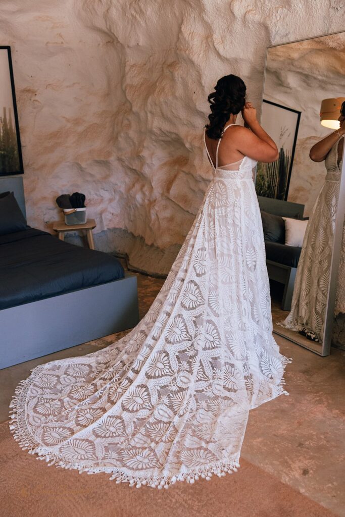 bride getting ready in a desert airbnb
