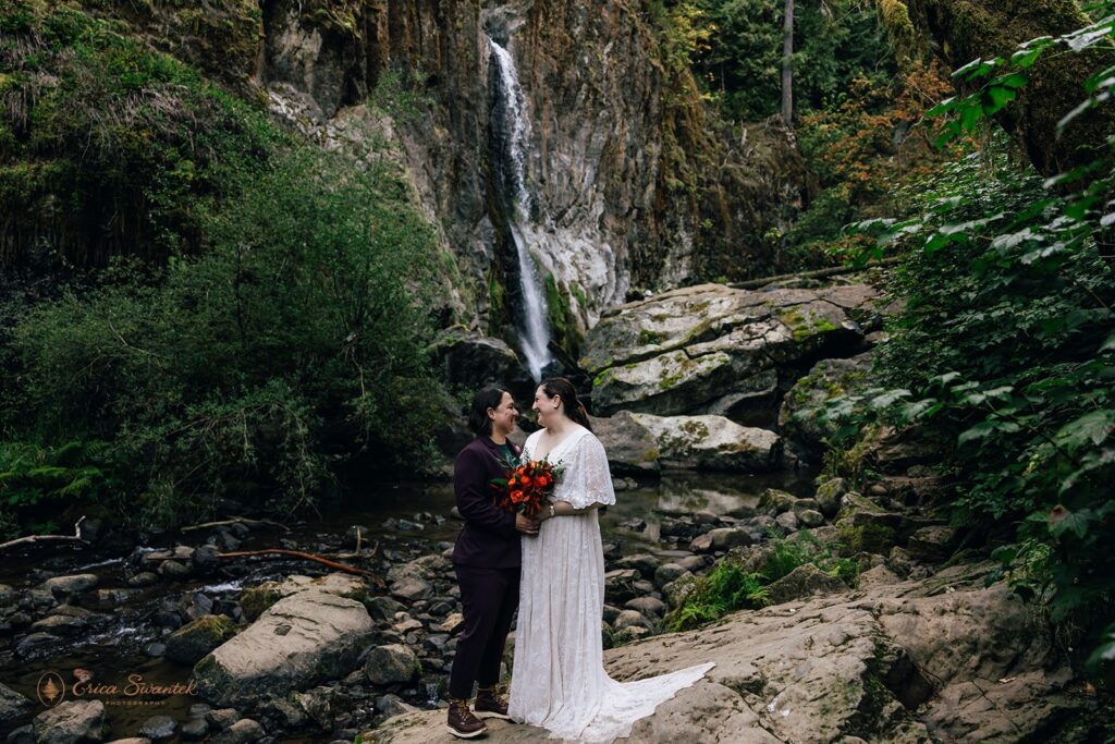 adventurous elopement couple during their waterfall elopement in the pacific northwest