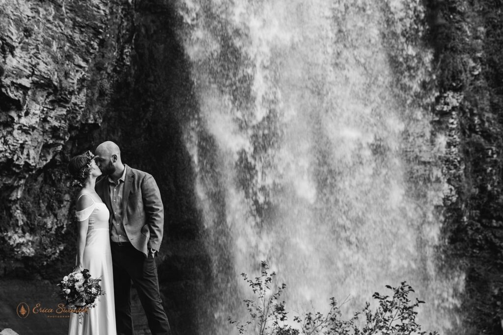 bride and groom snuggling during their pnw waterfall elopement
