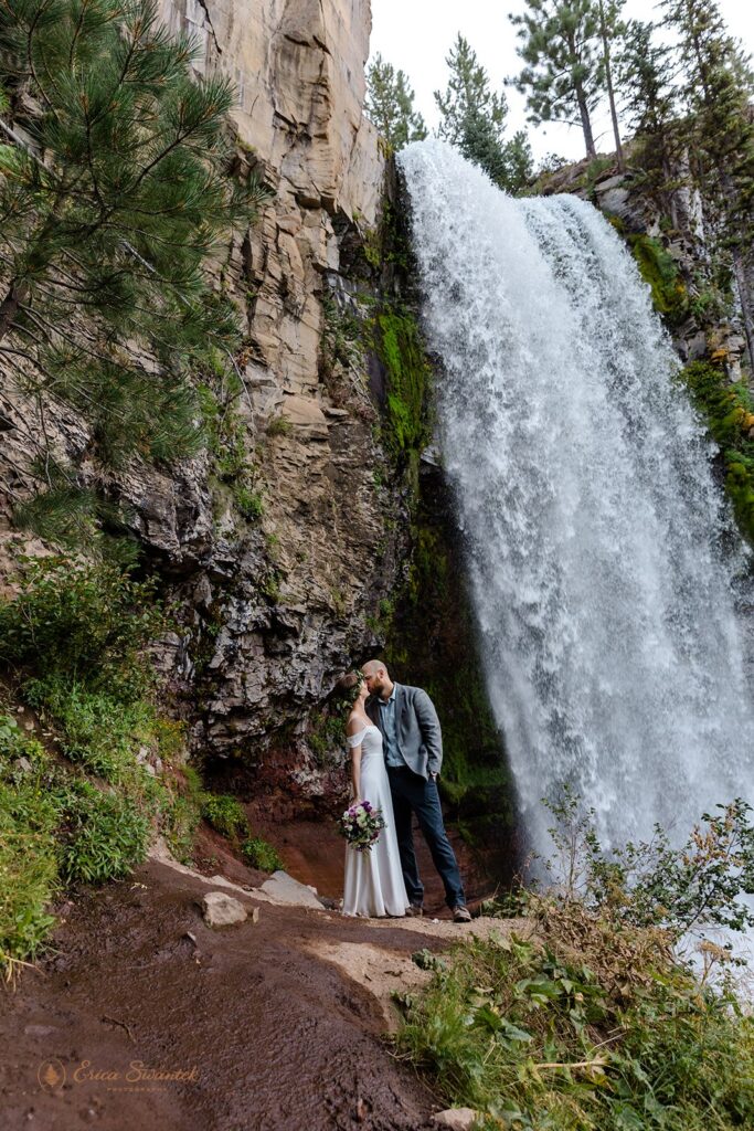 bride and groom snuggling during their pnw waterfall elopement